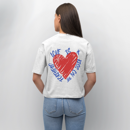 Herzfarben Oversize Damen T-Shirt „Love Is a Kiss on the Forehead“ – Nachhaltiges Statement Shirt aus Bio-Baumwolle - Weiß meliert
